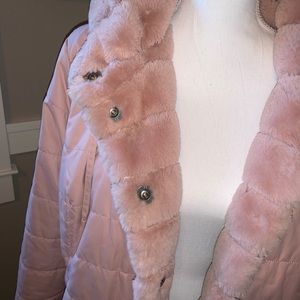 Reversible faux fur lined puffer coat.